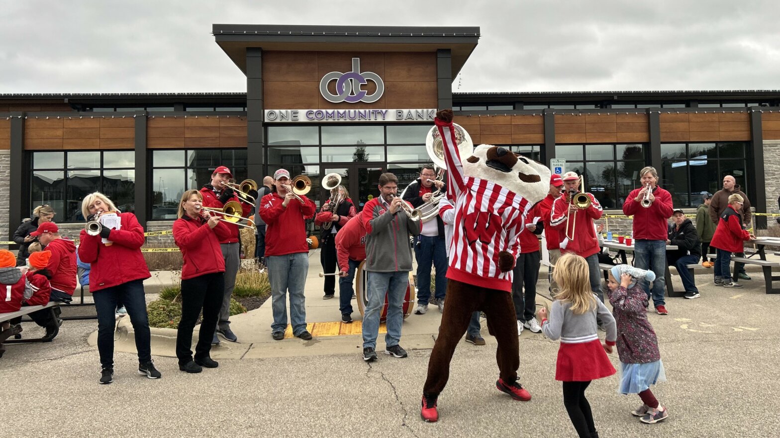 Bucky Badger and the UW Alumni Band at One Community Bank's Badger Tailgate event in 2023